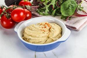 Creamy hummus in the bowl photo