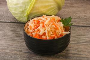 Sauerkraut - pickled cabbage in the bowl photo