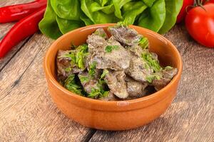 Chicken liver with cream sauce photo