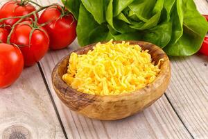 Shredded cheese in the bowl photo