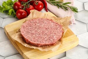 Raw beef uncooked burger cutlet photo