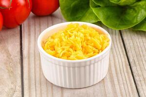 Shredded cheese in the bowl photo