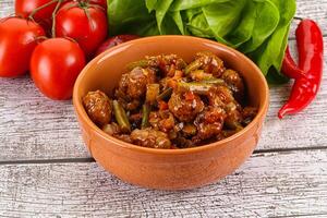 Meatball with vegetables and spices photo