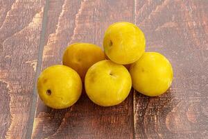 Yellow sweet plum heap fruit photo