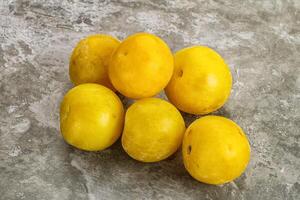 Yellow sweet plum heap fruit photo