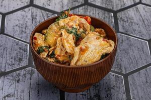 Thai red spicy curry with chicken photo