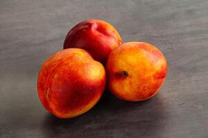 Ripe sweet juicy fresh red nectarines photo