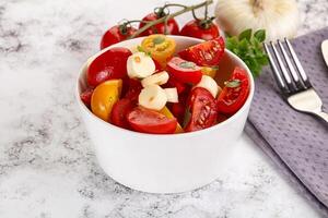 Italian Caprese salad with tomato and mozzarella photo