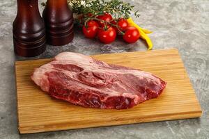 Raw beef chuck roll steak photo