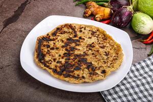 Indian cuisine stuffed Aloo paratha photo