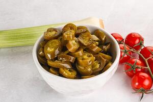 Sliced canned jalapeno pepper photo