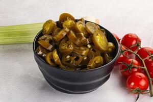 Sliced canned jalapeno pepper photo