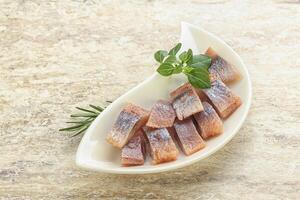 Delicous sliced herring fillet in grape sauce photo