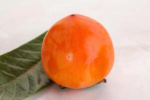 Fresh ripe sweet juicy persimmon photo