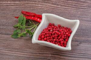 Red pepper seeds in the bowl photo