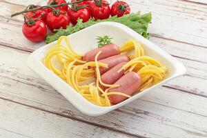 Mini sausages with pasta spaghetti photo