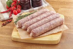 Raw pork sausages for grill photo