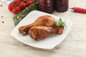 Roasted chicken legs with spicy sauce photo