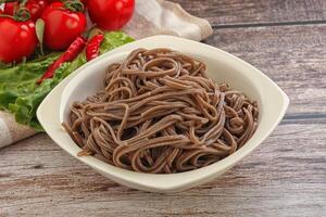 Asian cuisine - soba in the bowl photo