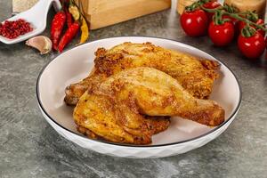 Roasted chicken leg with spices photo