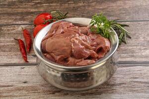 Raw chicken liver in the bowl photo