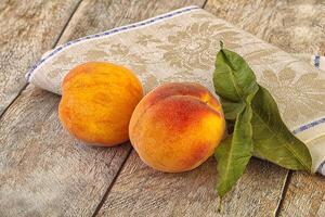 Two ripe sweet peaches fruit photo