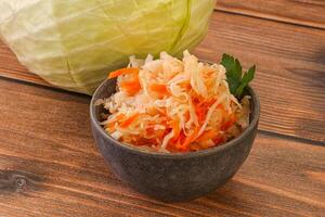 Sauerkraut - pickled cabbage in the bowl photo