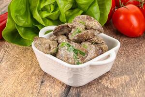 Chicken liver with cream sauce photo