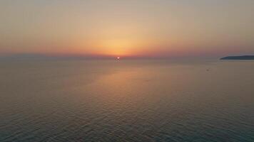 Sunset approach over tranquil sea video