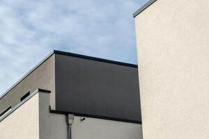 Flat roofs and walls of modern residential buildings photo