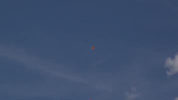 Paragliders soaring in blue sky video