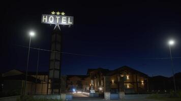 Glowing hotel sign at night video