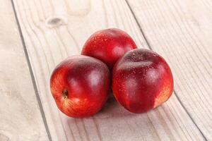 Ripe sweet juicy nectarines heap photo