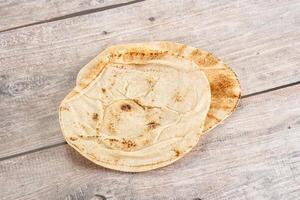 Traditional eastern round pita bread photo