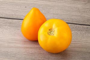 Ripe yellow bright juicy tomato photo