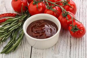 Tomato barbecue sauce on the bowl photo