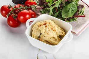 Creamy hummus in the bowl photo