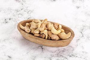 Cashew nuts heap in the bowl photo