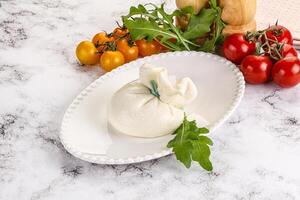 Creamy Italian traditional Burrata cheese photo