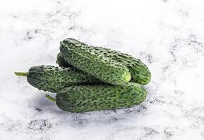 Fresh natural organic cucumbers heap photo