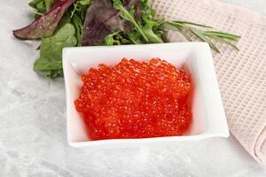 Red caviar in the bowl photo