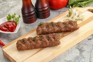 Kebab with beef served onion photo