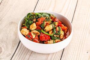 Chicken with tomato and spinach photo
