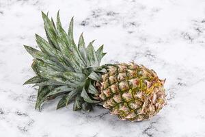 Sweet organic ripe tropical pineapple photo