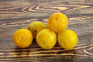 Yellow sweet plum heap fruit photo