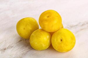 Yellow sweet plum heap fruit photo