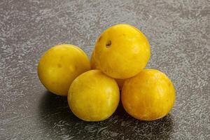 Yellow sweet plum heap fruit photo