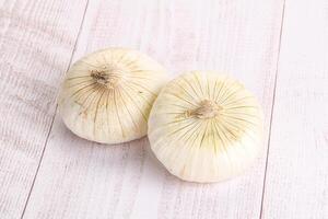 Raw white onion heap isolated photo