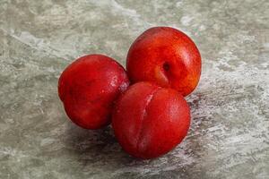 Ripe sweet juicy red plum photo