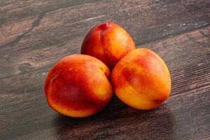 Ripe sweet juicy fresh red nectarines photo